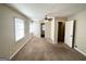 Main bedroom with carpet, ceiling fan, and access to bath at 239 Silver Springs Sw Cir, Atlanta, GA 30310