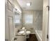 Updated bathroom with granite vanity and marble tile shower/tub at 3438 Maryvale Dr, Decatur, GA 30032