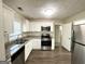 Updated kitchen featuring granite countertops and stainless steel appliances at 3438 Maryvale Dr, Decatur, GA 30032