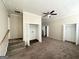 Upper floor hallway with stairs, closets, and carpeted flooring at 3438 Maryvale Dr, Decatur, GA 30032