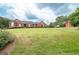 Ranch style home with a large yard and barn at 1600 Pinehurst Rd, Grayson, GA 30017