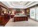 Spacious main bedroom with a coffered ceiling and large windows at 1600 Pinehurst Rd, Grayson, GA 30017