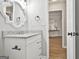 Guest bathroom with granite vanity and view to living area at 613 Ambrose Ln, Peachtree City, GA 30269