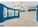 Cozy bedroom with bay window, ceiling fan, and built-in shelves at 119 Castlewood Rd, Tyrone, GA 30290