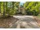 Two-story house with driveway and mature trees at 119 Castlewood Rd, Tyrone, GA 30290