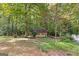 Wooded lot with detached workshop, offering privacy at 119 Castlewood Rd, Tyrone, GA 30290