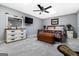 Basement bedroom with dresser, king bed, and ceiling fan at 2800 S Highway 16, Carrollton, GA 30116