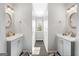 Double vanity bathroom with neutral tones and an arched window at 2800 S Highway 16, Carrollton, GA 30116