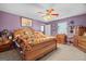Primary bedroom with wooden bed frame and southwestern decor at 2800 S Highway 16, Carrollton, GA 30116