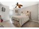 Bedroom featuring ceiling fan, wood platform bed, and dresser at 2800 S Highway 16, Carrollton, GA 30116