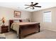 Spacious bedroom with ceiling fan, large bed, and nightstands at 2800 S Highway 16, Carrollton, GA 30116