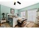 Bright bedroom with a ceiling fan and large windows at 2800 S Highway 16, Carrollton, GA 30116