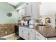 Kitchen features granite countertops and white cabinets at 2800 S Highway 16, Carrollton, GA 30116