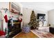 Living room with a fireplace and a decorated Christmas tree at 2800 S Highway 16, Carrollton, GA 30116