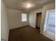 Bright bedroom with closet and window at 870 Fincher Rd, Covington, GA 30016