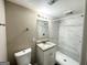 Updated bathroom with marble shower and granite vanity at 2390 Candler Rd, Decatur, GA 30032