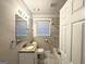 Renovated bathroom with a bathtub and granite countertop at 2390 Candler Rd, Decatur, GA 30032