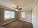 Well-lit bedroom with neutral walls and carpeted floors at 2390 Candler Rd, Decatur, GA 30032