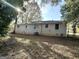 Brick ranch house with a large backyard and mature trees at 2390 Candler Rd, Decatur, GA 30032