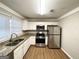 Modern kitchen with stainless steel appliances and granite countertops at 2390 Candler Rd, Decatur, GA 30032