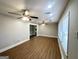 Bright and airy living room with hardwood floors and ceiling fan at 2390 Candler Rd, Decatur, GA 30032