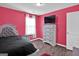 Pink bedroom with a twin bed and a dresser at 2805 Ellis Pointe Ave, Conyers, GA 30094