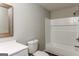 Clean bathroom with a tub and shower, updated vanity, and modern fixtures at 5661 Dillwood Cres, Lithonia, GA 30058