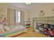 Bright bedroom with a bunk bed, and rainbow striped bedding at 435 Crabapple Rd, Fayetteville, GA 30215