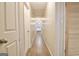 Long hallway with light walls and wood flooring at 435 Crabapple Rd, Fayetteville, GA 30215