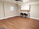 Finished basement with vinyl flooring, built-in cabinets, and bar stools at 2193 Hiram Douglasville Hwy, Hiram, GA 30141