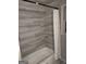 Bathroom with grey tile shower/tub surround and shelves at 2193 Hiram Douglasville Hwy, Hiram, GA 30141