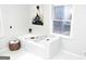 Elegant bathroom with a freestanding bathtub and marble tile flooring at 2193 Hiram Douglasville Hwy, Hiram, GA 30141