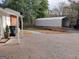 Brick home with covered patio, metal carport, and landscaping at 2193 Hiram Douglasville Hwy, Hiram, GA 30141