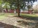 Brick ranch house with a large backyard and mature trees at 2193 Hiram Douglasville Hwy, Hiram, GA 30141