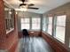 Bright sunroom with brick walls, vinyl flooring, and ample natural light at 2193 Hiram Douglasville Hwy, Hiram, GA 30141