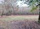 Large wooded lot with cleared areas and mature trees at 2193 Hiram Douglasville Hwy, Hiram, GA 30141