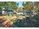 Backyard view showing home and storage sheds at 1883 Fort Valley Dr, Atlanta, GA 30311