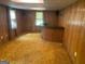 Finished basement recreation room with bar and wood paneling at 4929 Joy Sw Ln, Lilburn, GA 30047