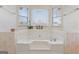 Bathroom boasts a large garden tub and three windows at 453 Camp Hill Ln, Jonesboro, GA 30238