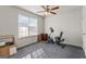 Bright bedroom features a large window, ceiling fan, and carpeted floor at 453 Camp Hill Ln, Jonesboro, GA 30238