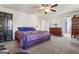 Main bedroom with king-size bed, dresser, and ceiling fan at 453 Camp Hill Ln, Jonesboro, GA 30238