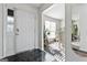 Bright entryway with view into dining room and hardwood floors at 453 Camp Hill Ln, Jonesboro, GA 30238