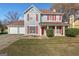 Two-story house with attached garage and red accents at 453 Camp Hill Ln, Jonesboro, GA 30238