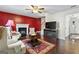 Living room with fireplace, hardwood floors, and two armchairs at 453 Camp Hill Ln, Jonesboro, GA 30238