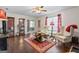 Living room with hardwood floors, fireplace and view into kitchen at 453 Camp Hill Ln, Jonesboro, GA 30238