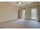 Spacious bedroom with neutral walls, carpet, and large windows at 960 Todd Dr, Covington, GA 30014