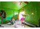 Bright bedroom with green walls and ceiling fan at 9025 Huntwood Ln, Riverdale, GA 30274