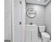 Basement bathroom with white vanity and gray brick at 987 Overbrook Cir, Marietta, GA 30062