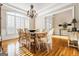 Formal dining room with chandelier and hardwood floors at 745 Woodscape Trl, Johns Creek, GA 30022