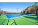 Enjoy a friendly game on these well-lit tennis courts at 745 Woodscape Trl, Johns Creek, GA 30022